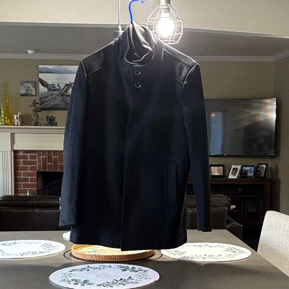 Brand new, never been worn, men’s wool coat.